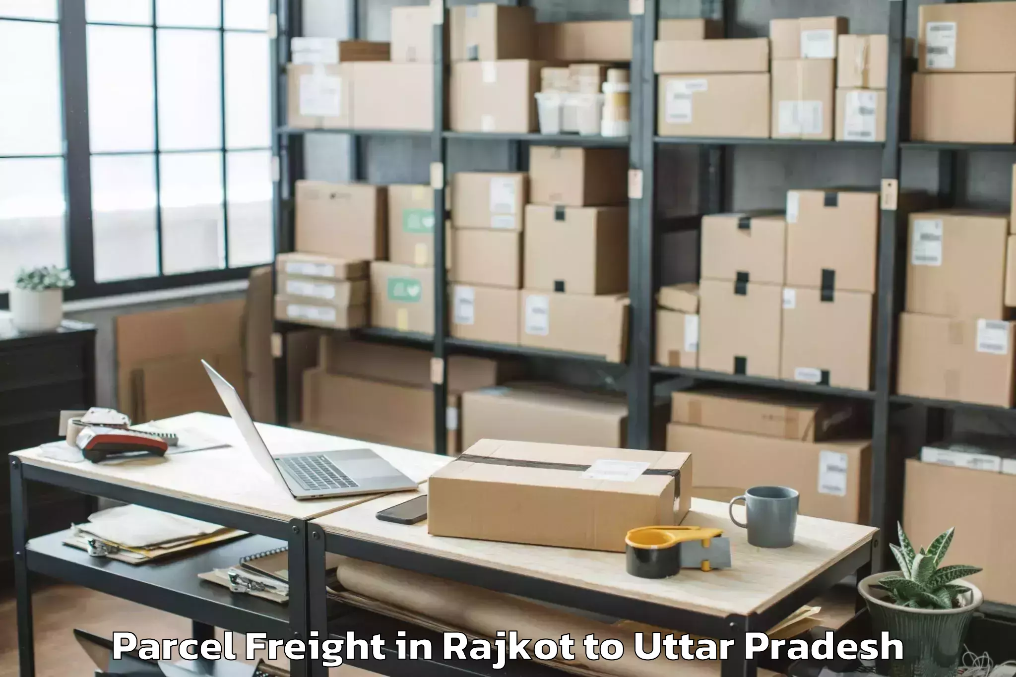 Book Rajkot to Padrauna Parcel Freight